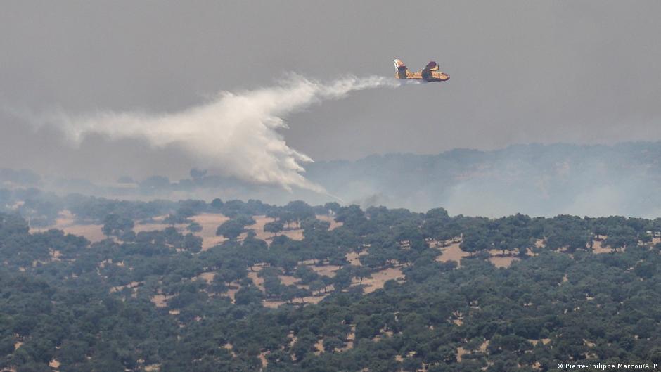 Europe wildfires: Many flee by boat as fires spread, merge